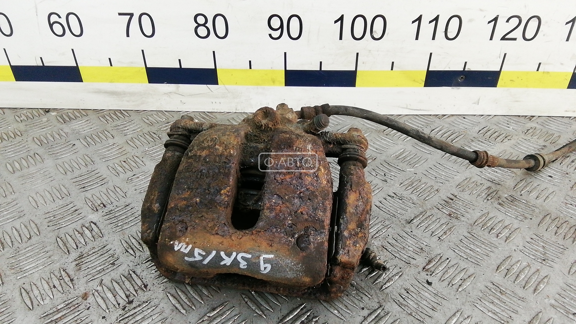 Суппорт тормозной передний левый