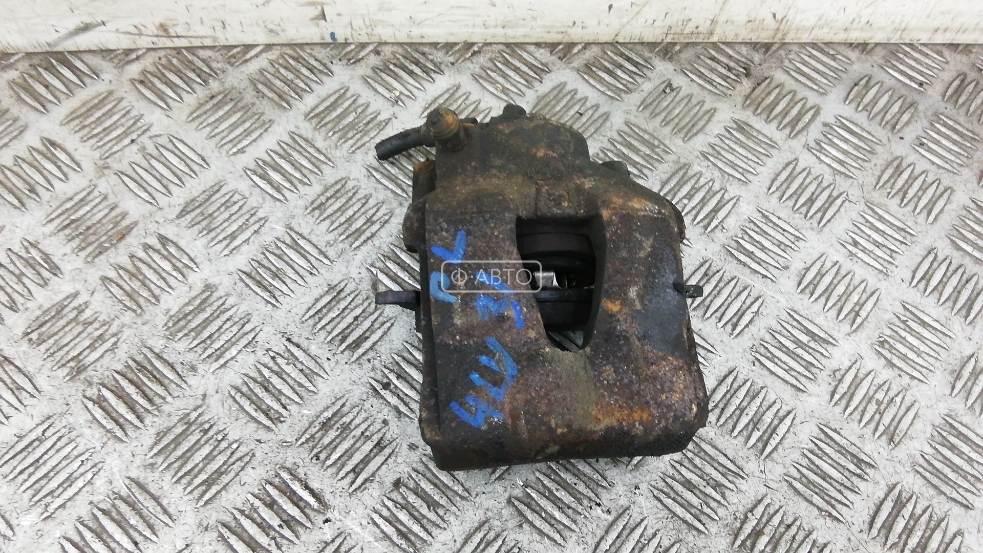 Суппорт тормозной передний левый