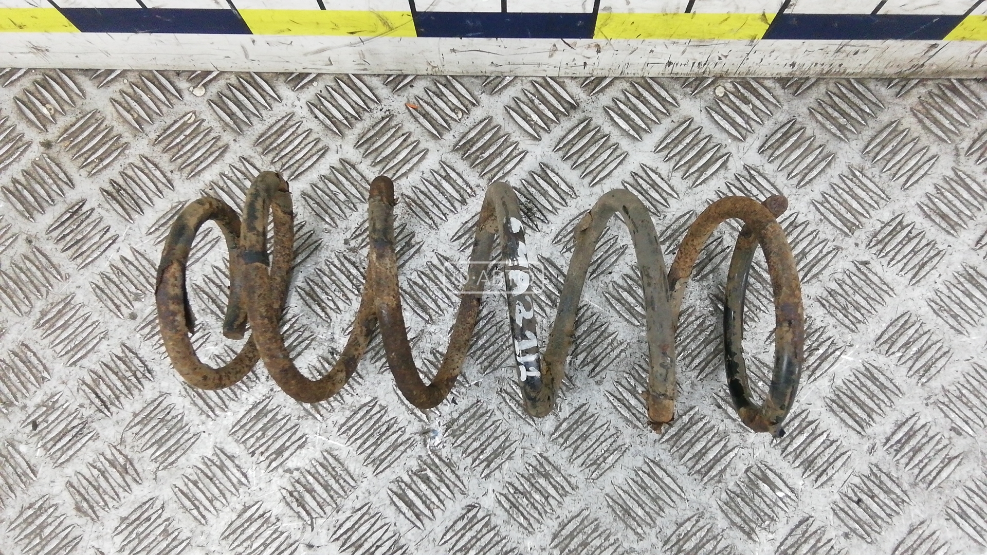 Пружина задняя