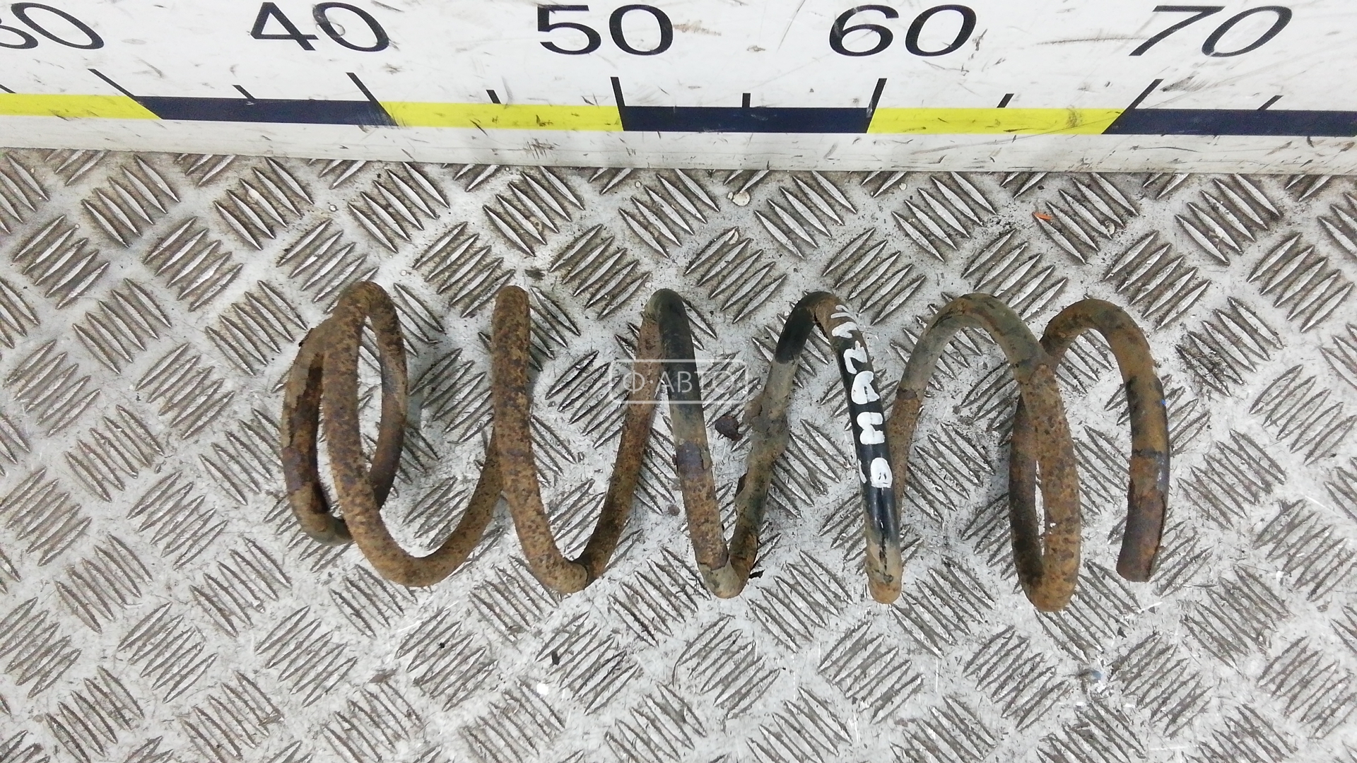 Пружина задняя