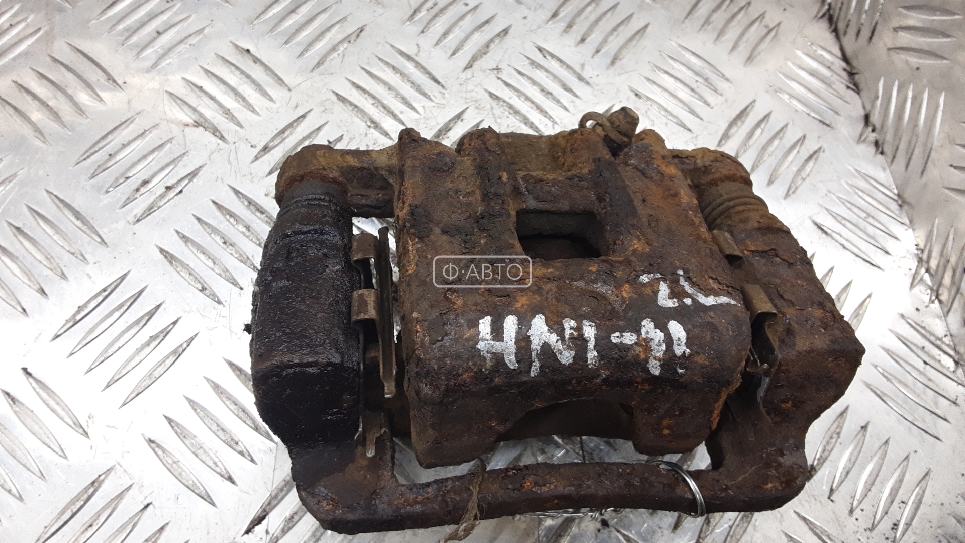 Суппорт тормозной задний левый