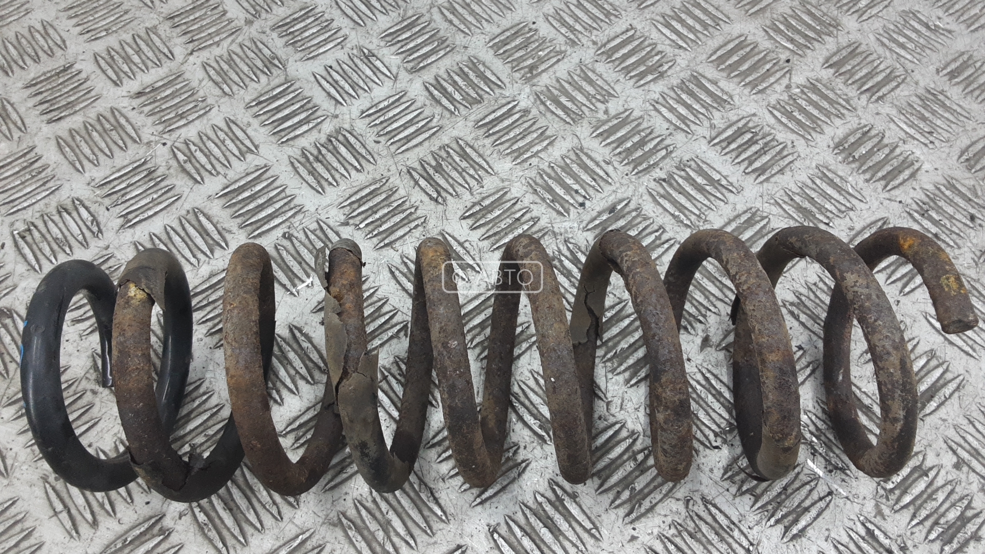 Пружина задняя