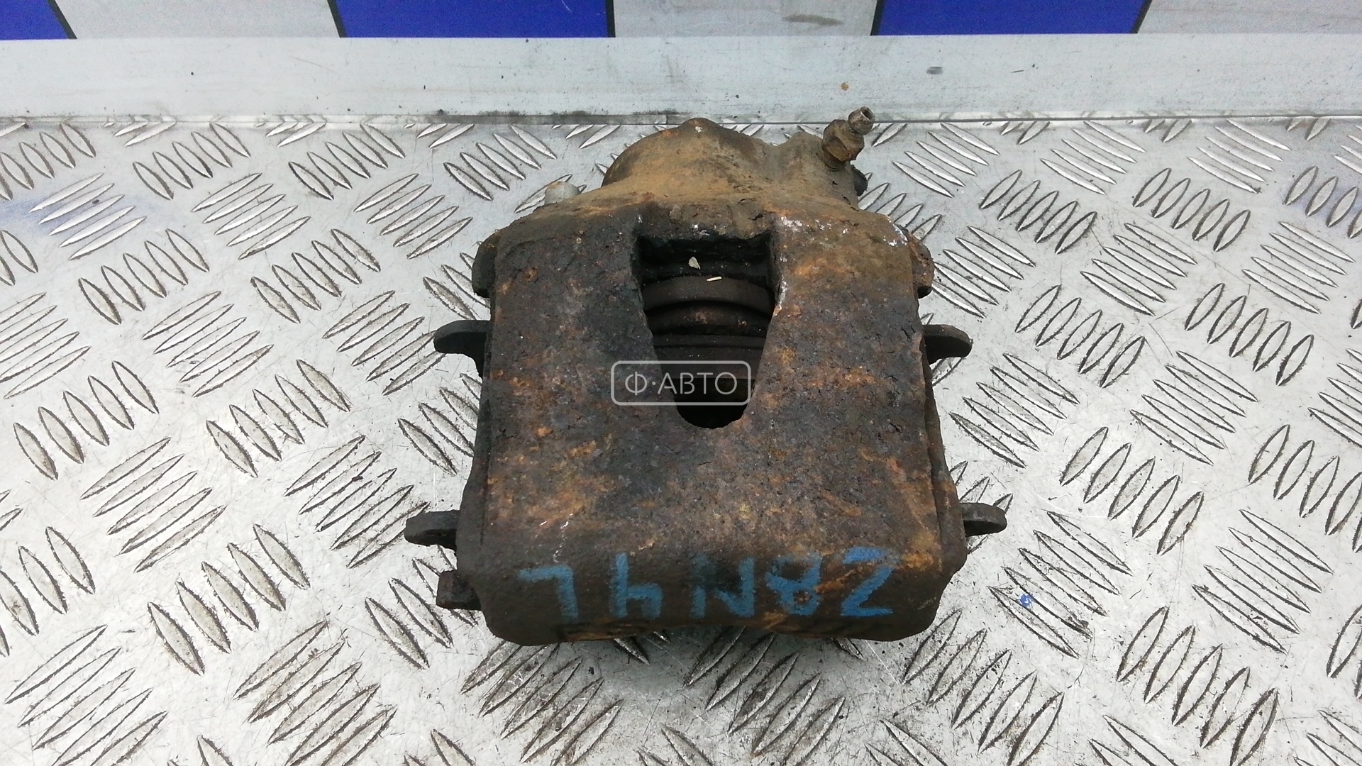 Суппорт тормозной передний левый