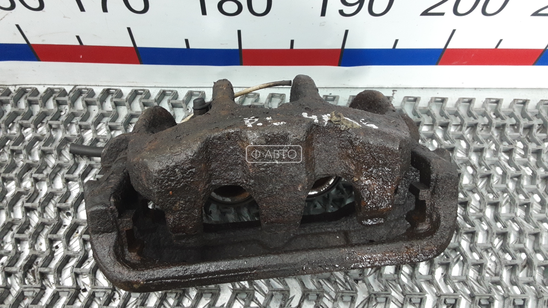 Суппорт тормозной передний левый