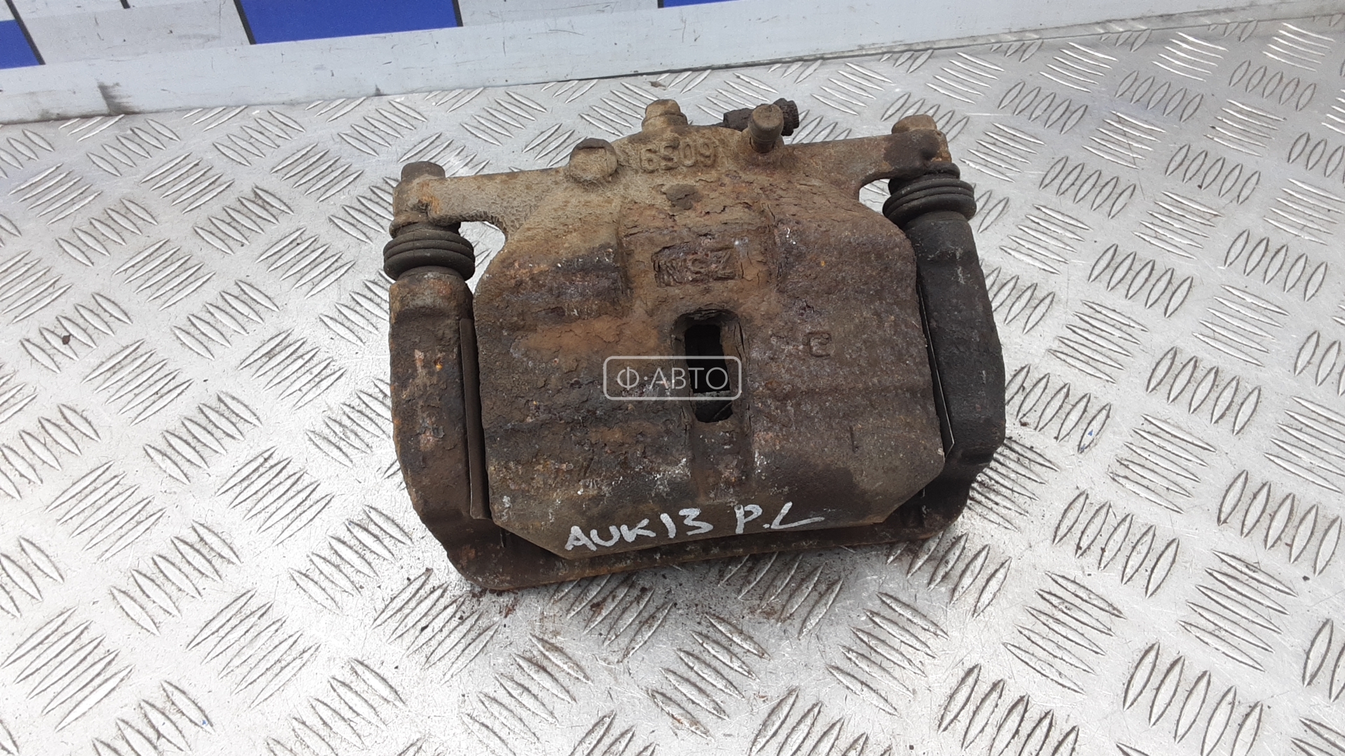 Суппорт тормозной передний левый