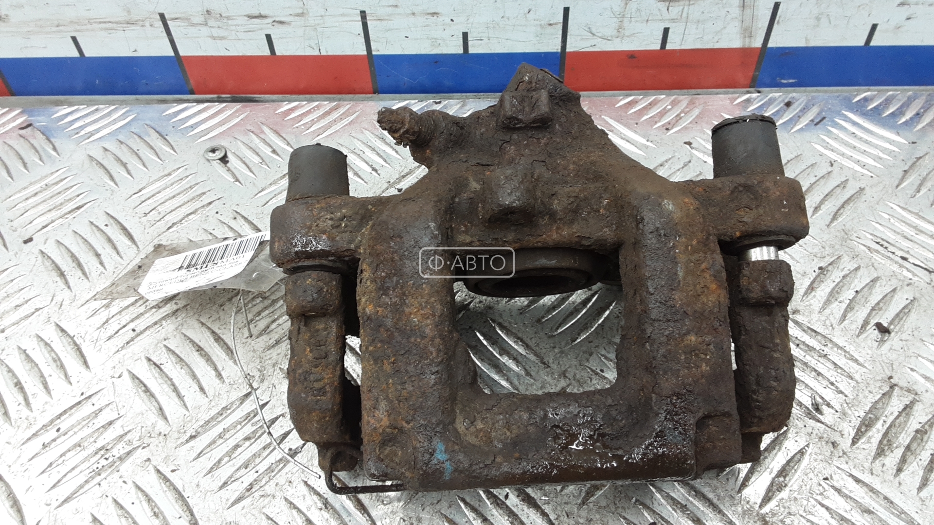 Суппорт тормозной задний левый