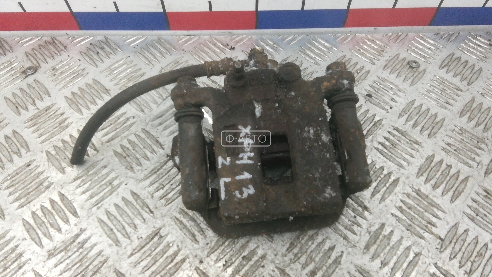 Суппорт тормозной задний левый