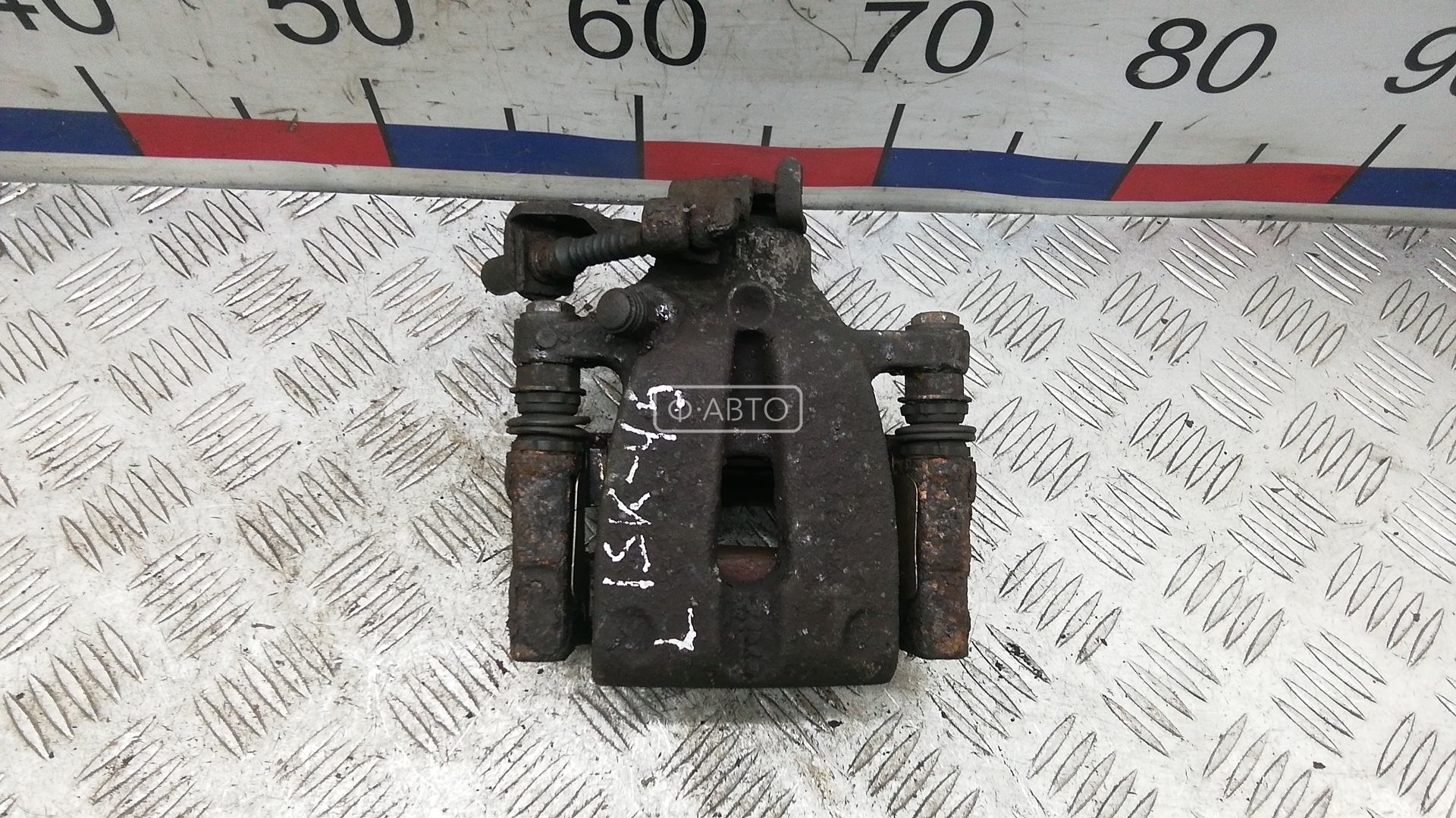 Суппорт тормозной задний левый