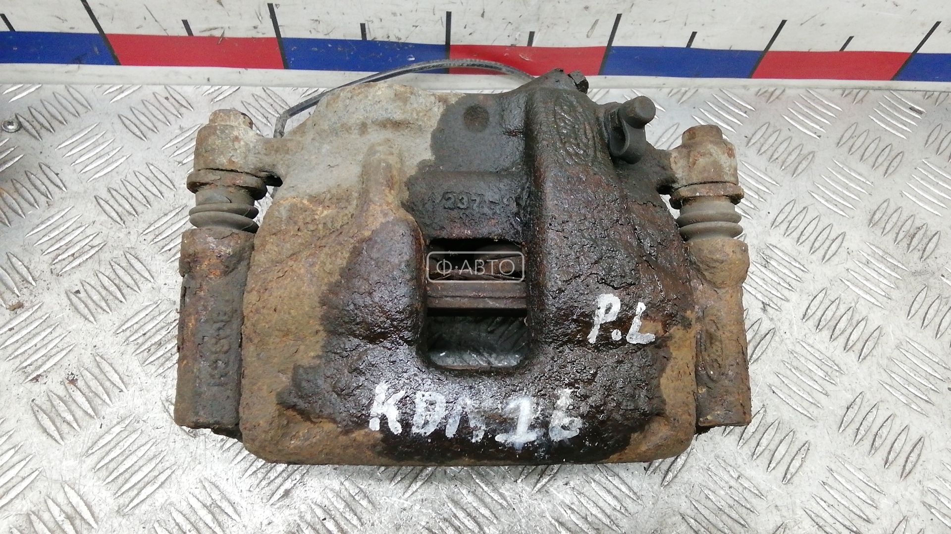 Суппорт тормозной передний левый