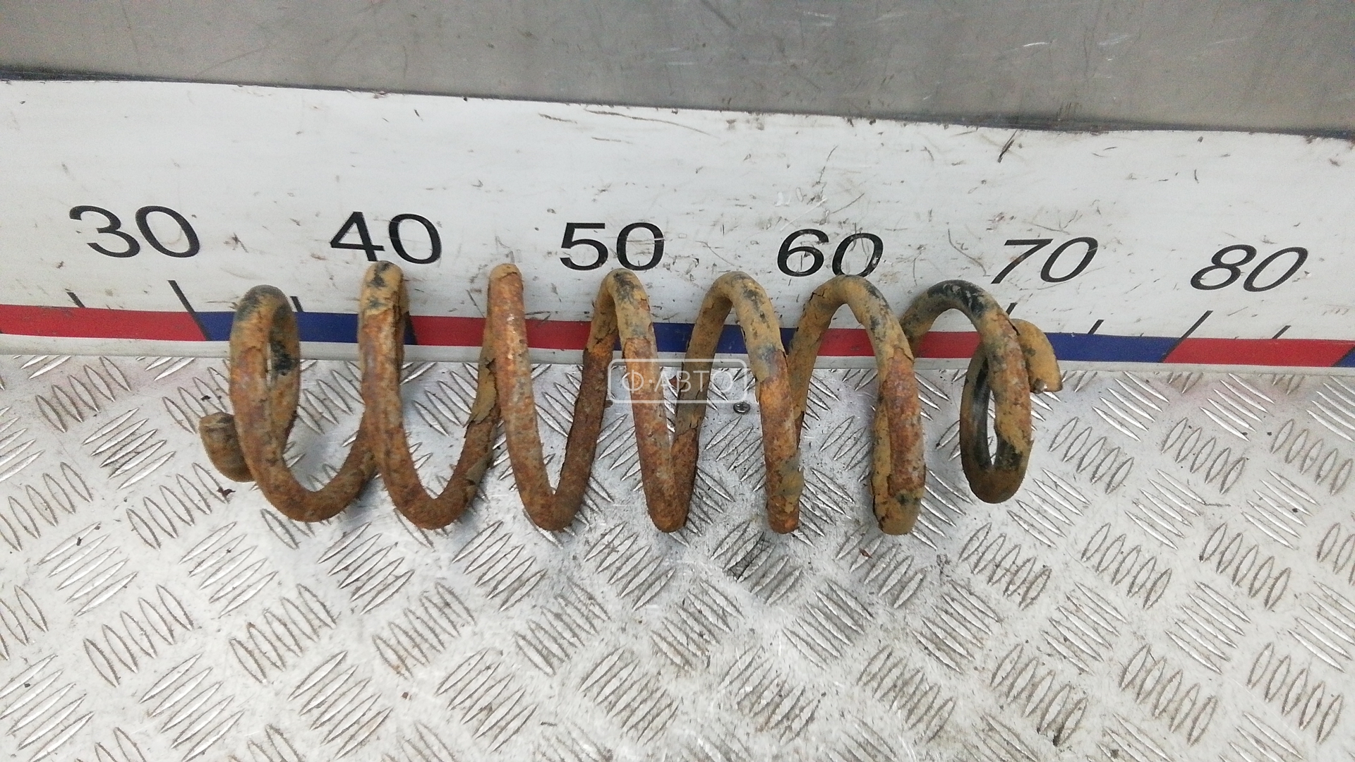 Пружина задняя