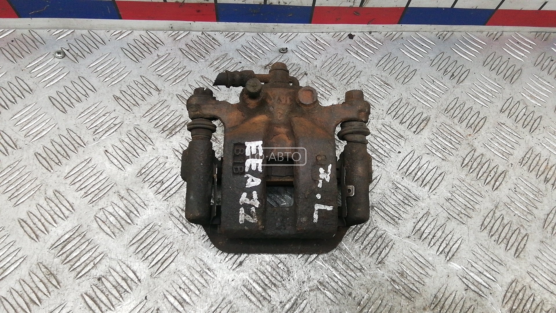 Суппорт тормозной задний левый
