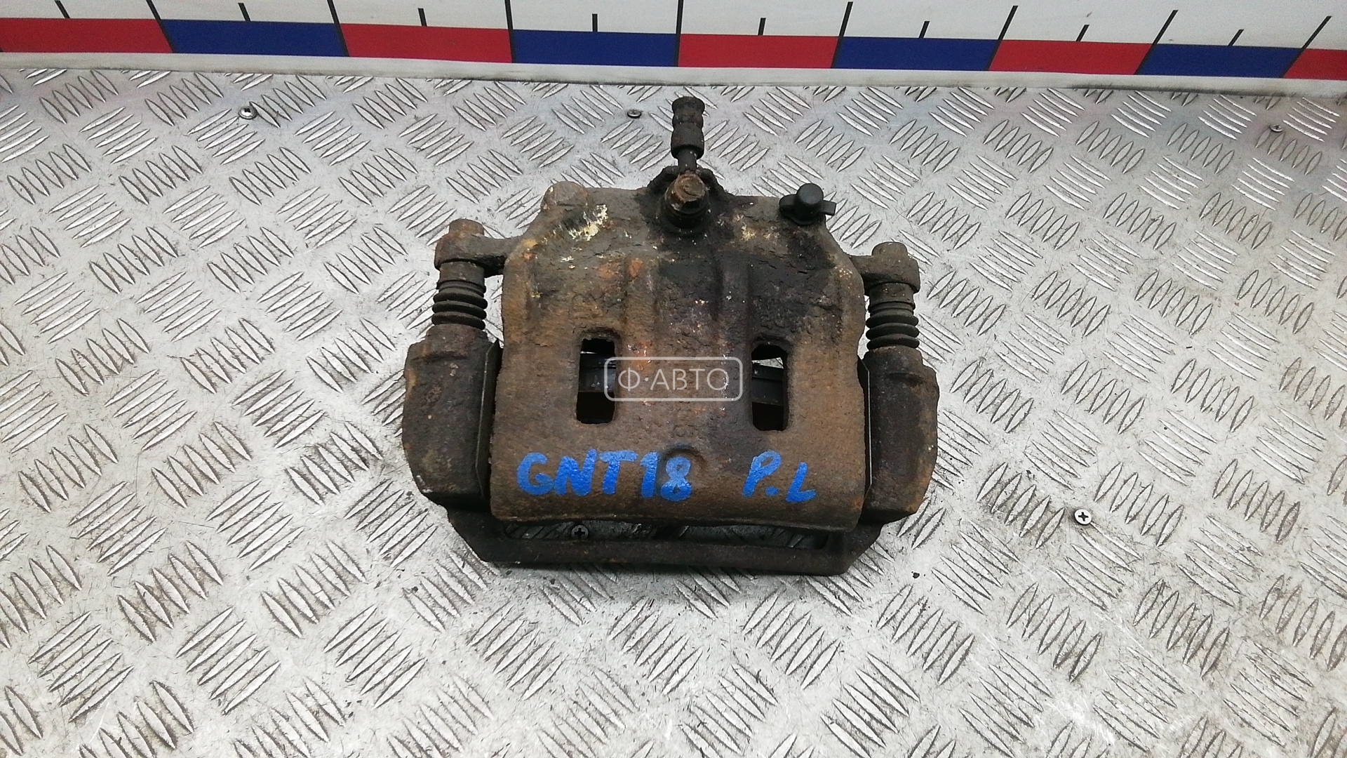 Суппорт тормозной передний левый