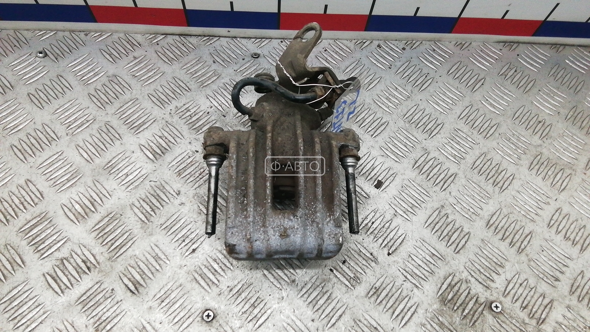 Суппорт тормозной задний левый