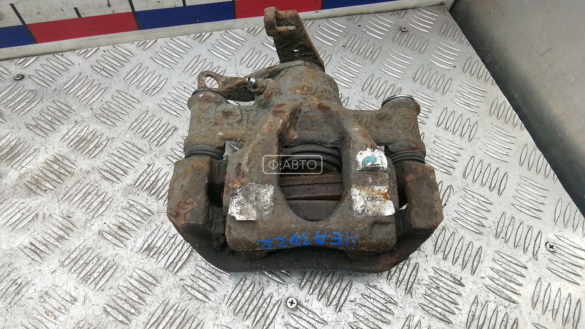 Суппорт тормозной задний левый