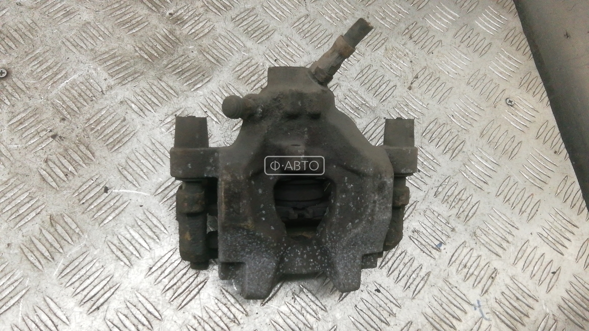 Суппорт тормозной задний левый