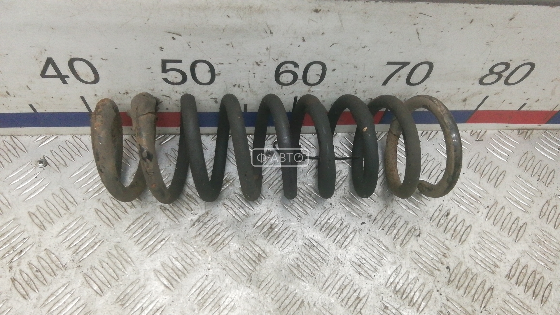Пружина задняя