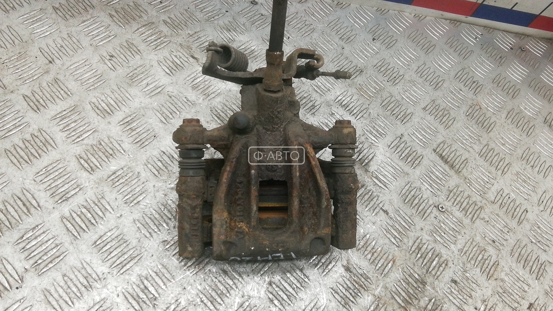 Суппорт тормозной задний левый