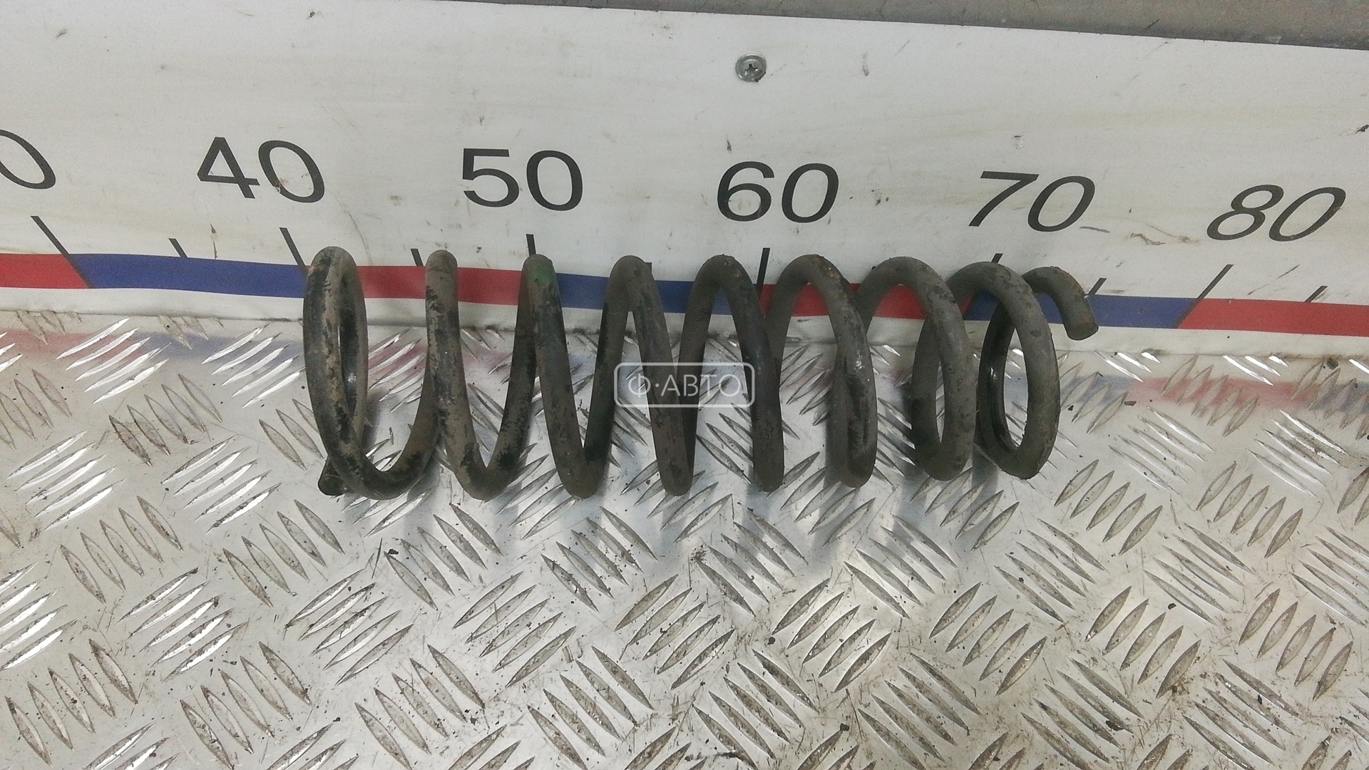 Пружина задняя