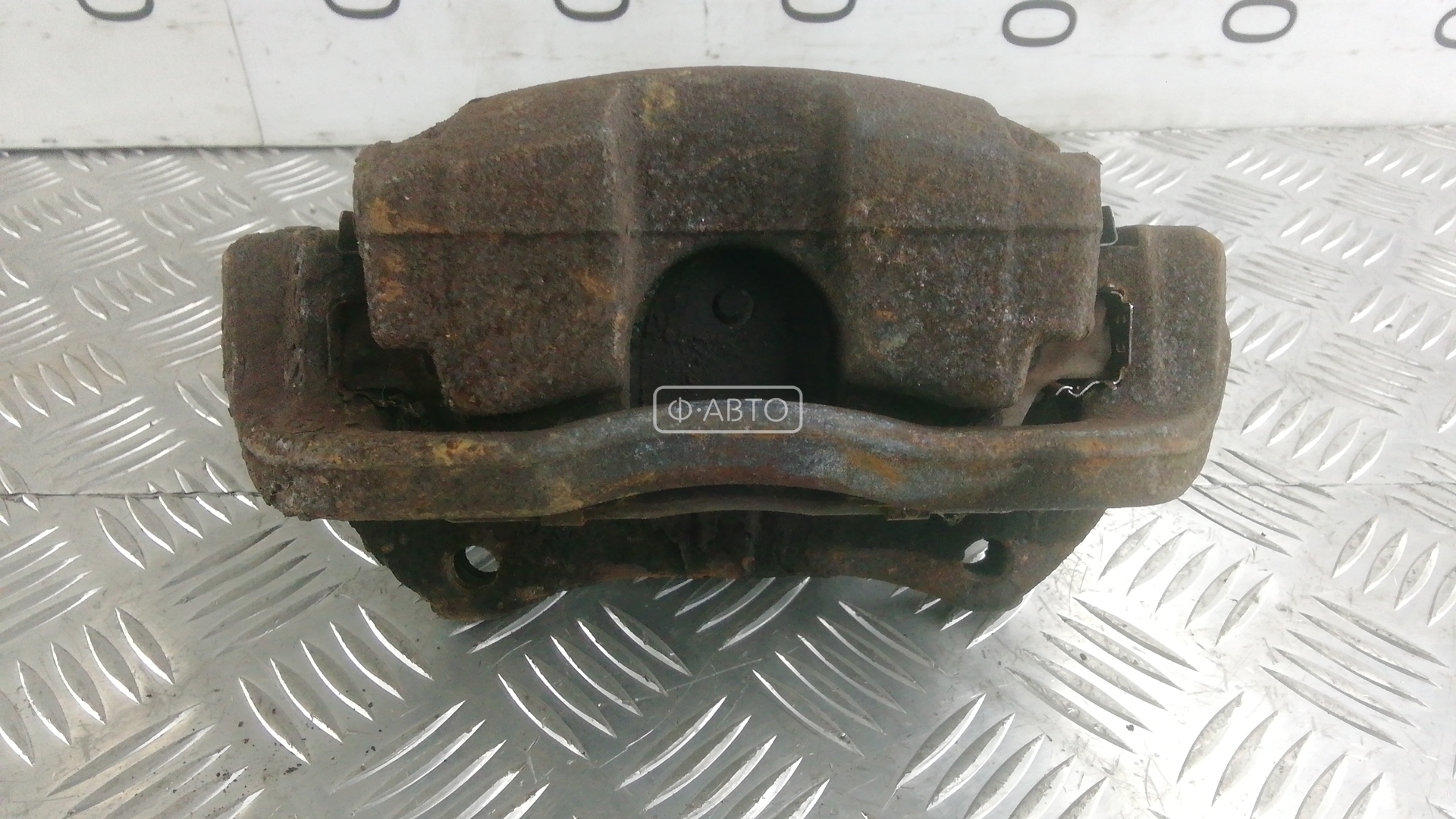 Суппорт тормозной передний левый