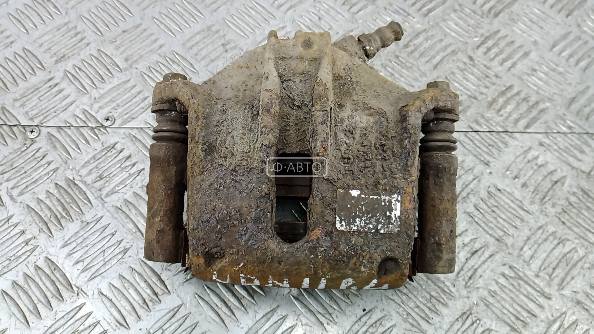 Суппорт тормозной передний левый