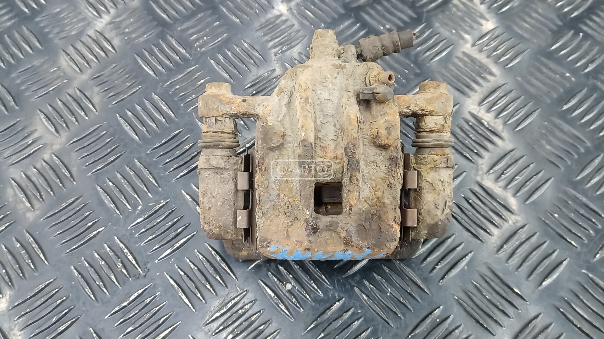 Суппорт тормозной задний левый