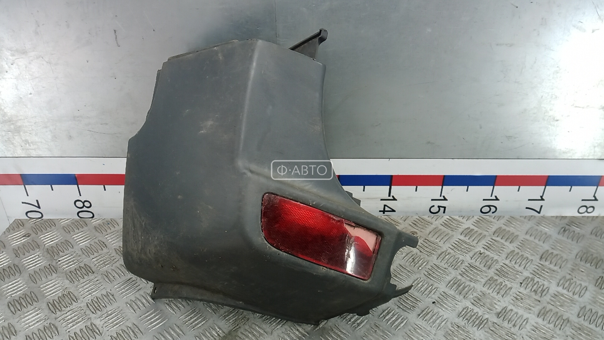 Клык бампера задний левый