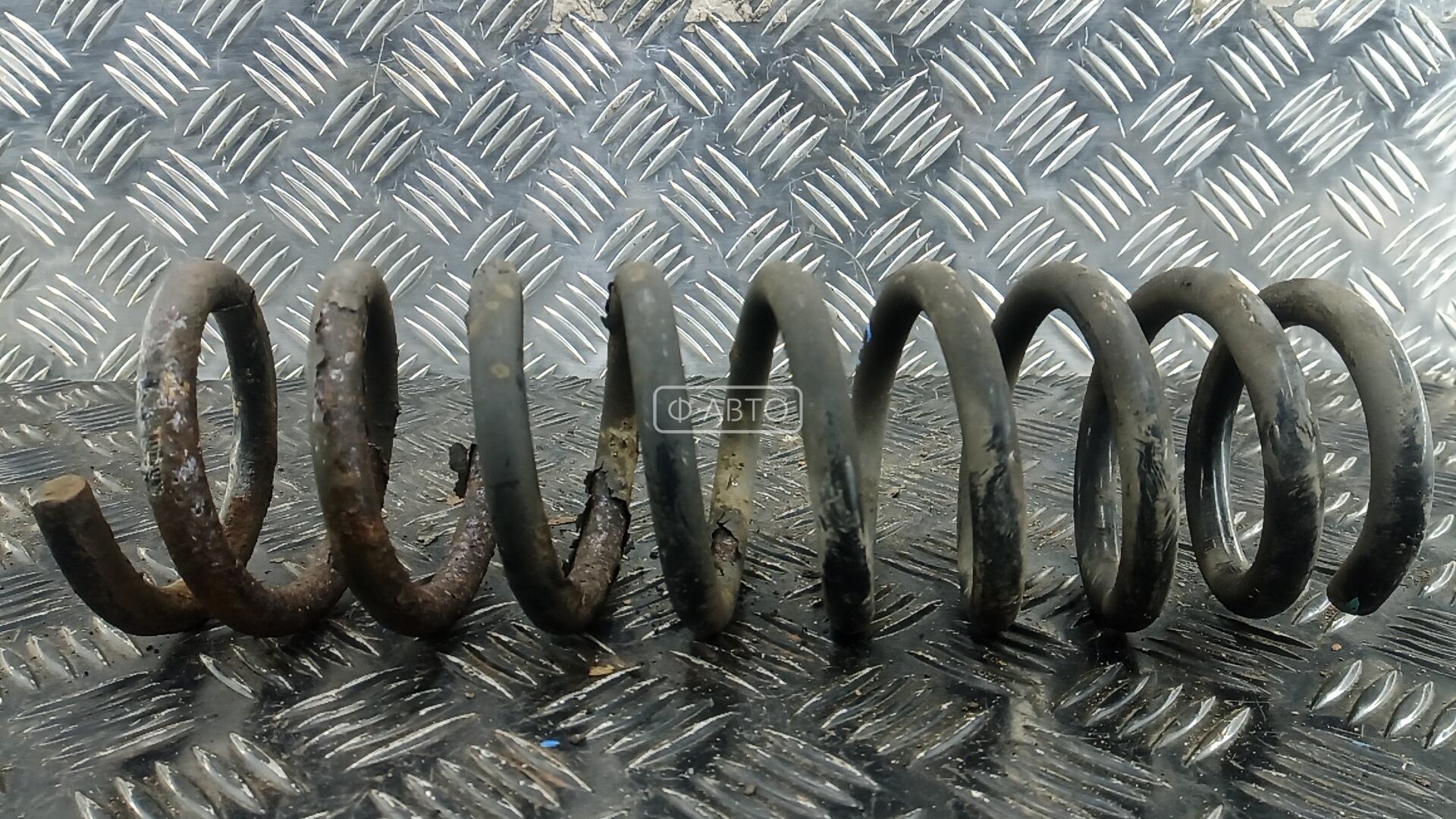 Пружина задняя