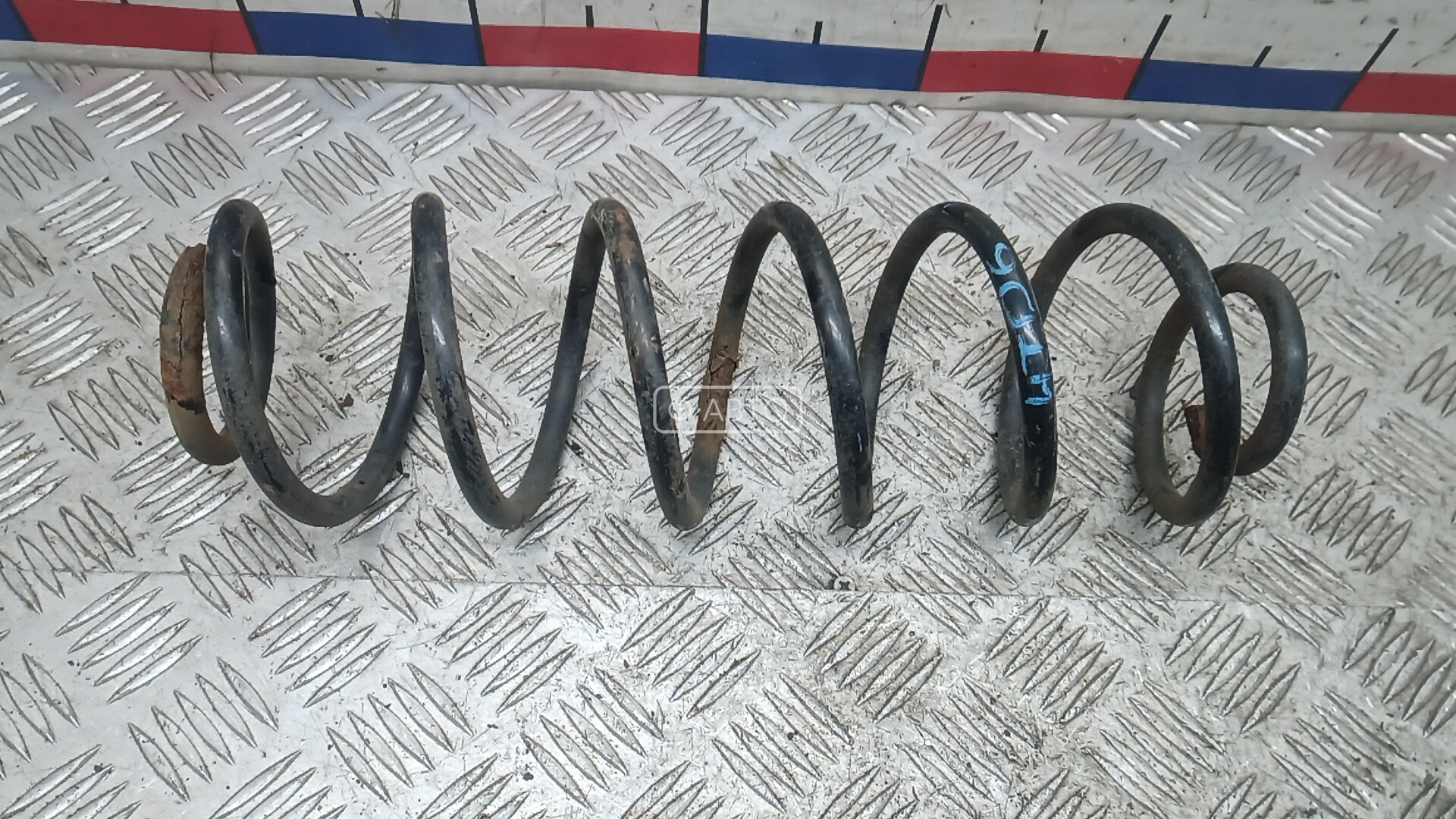 Пружина задняя