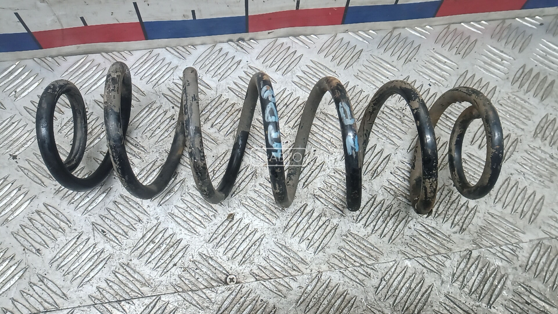 Пружина задняя