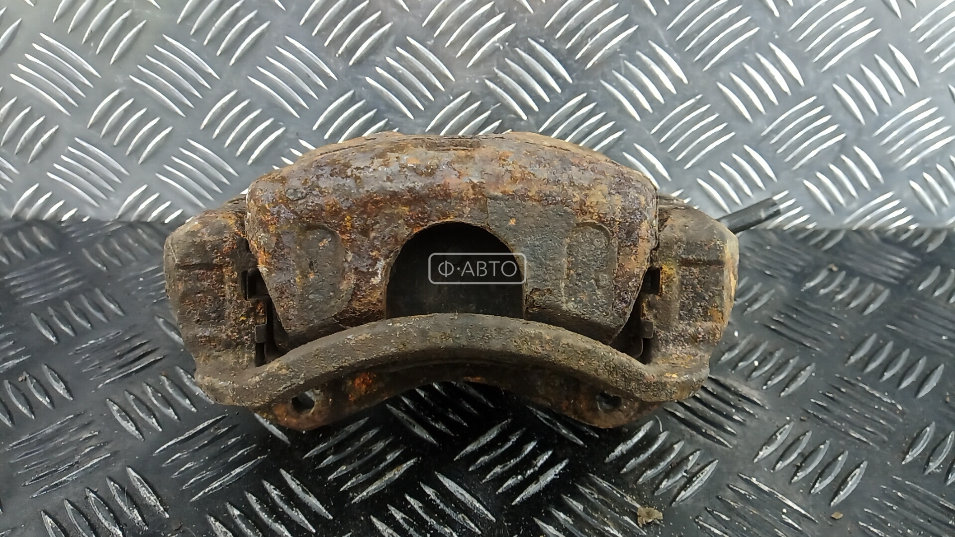 Суппорт тормозной передний левый