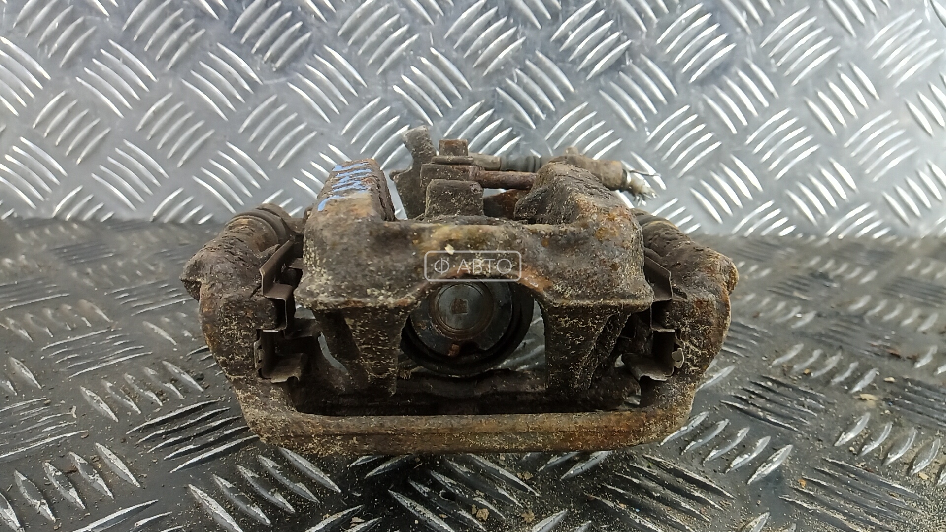 Суппорт тормозной задний левый