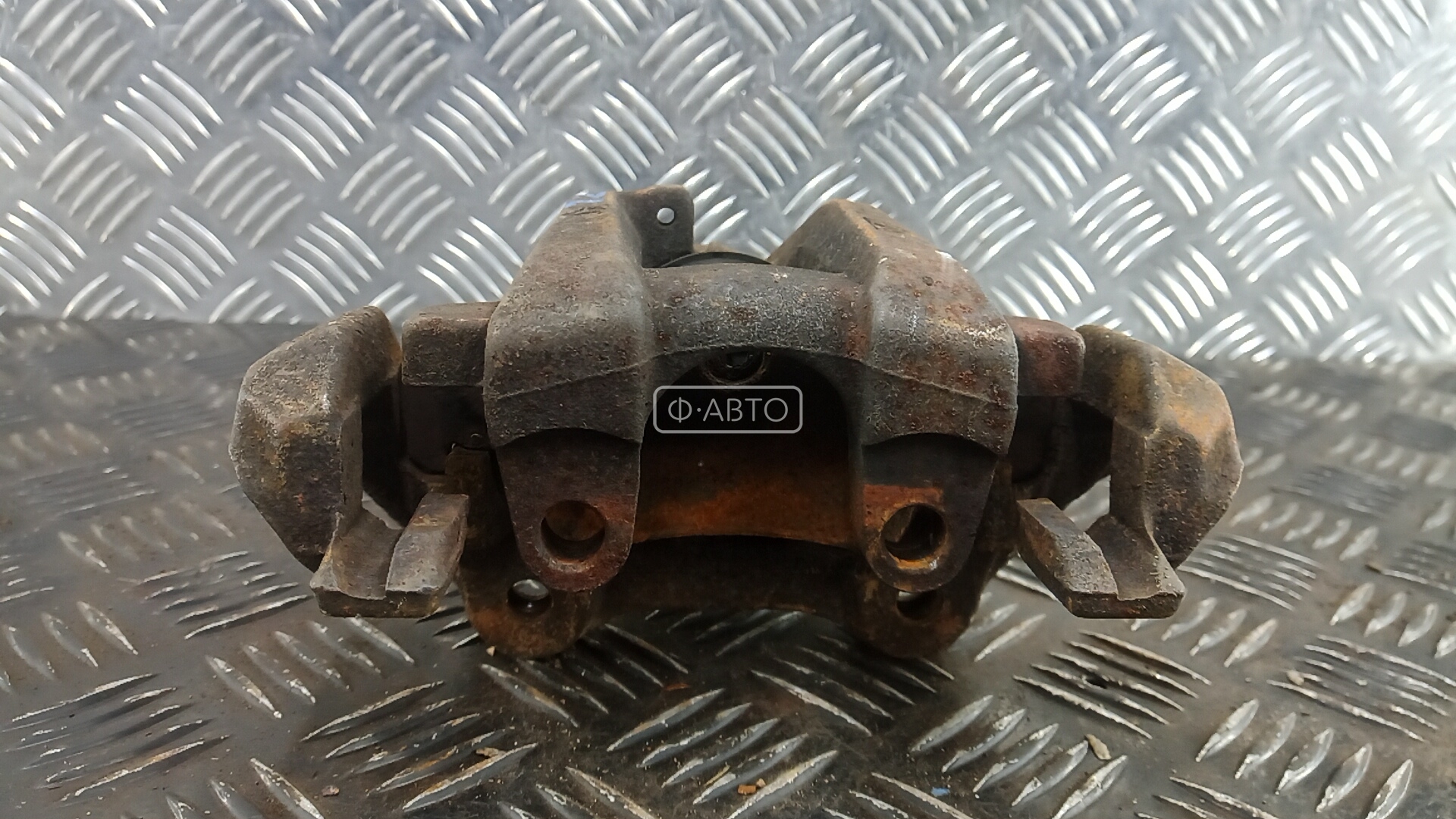 Суппорт тормозной задний левый