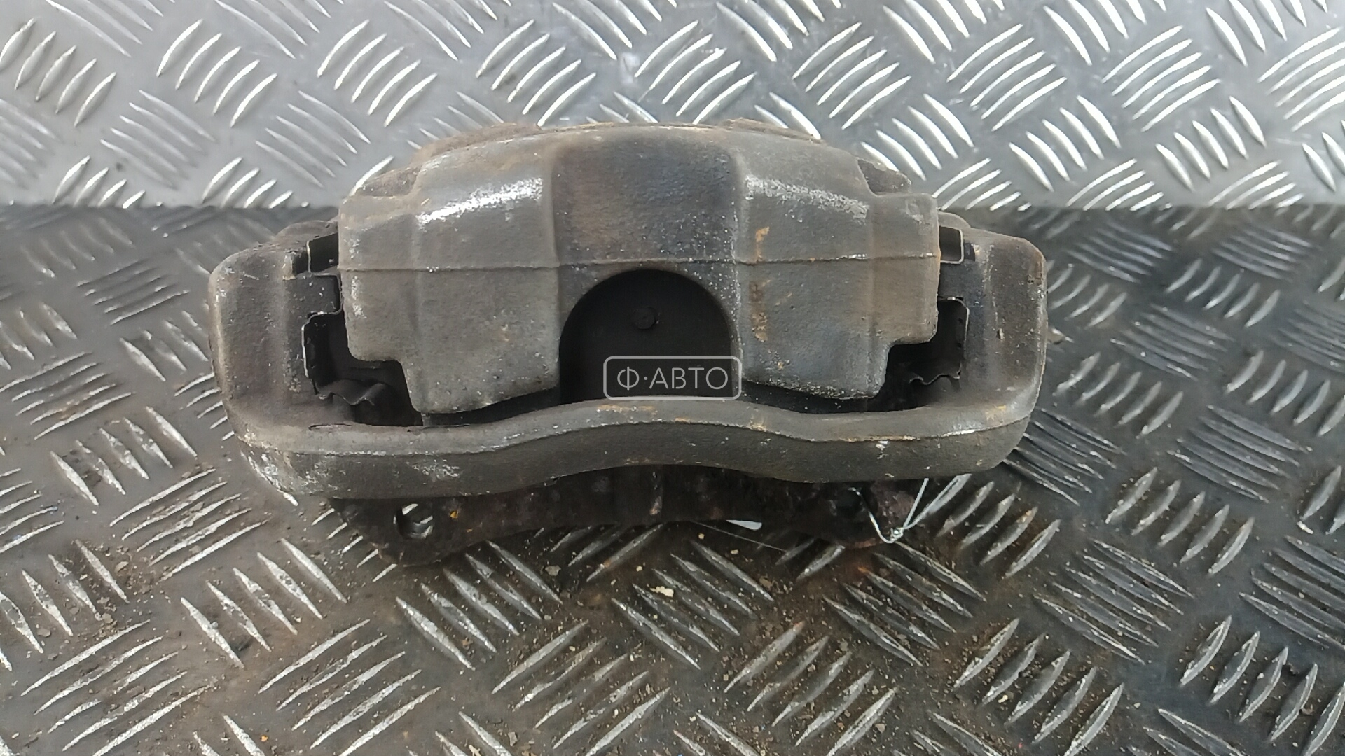 Суппорт тормозной передний левый