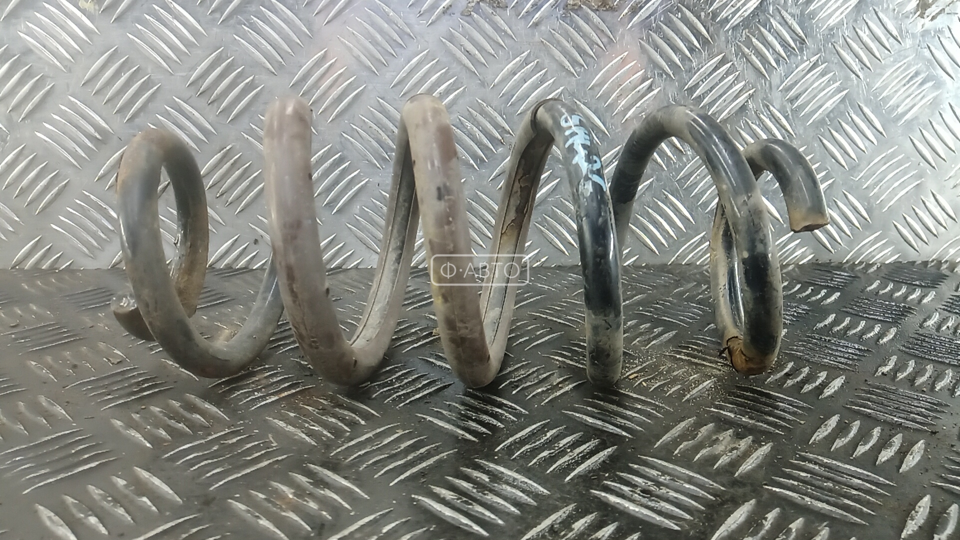 Пружина задняя