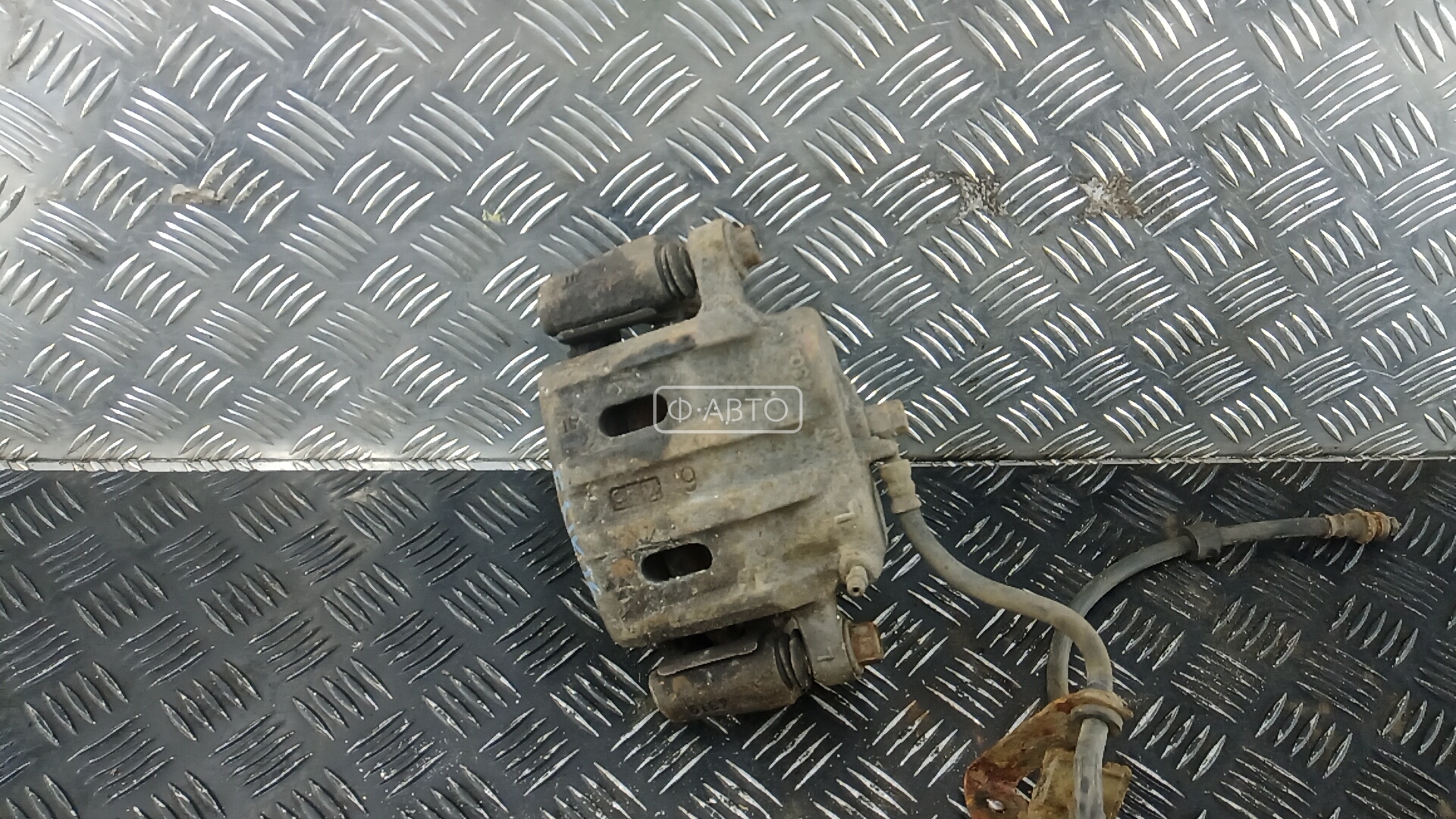 Суппорт тормозной передний левый