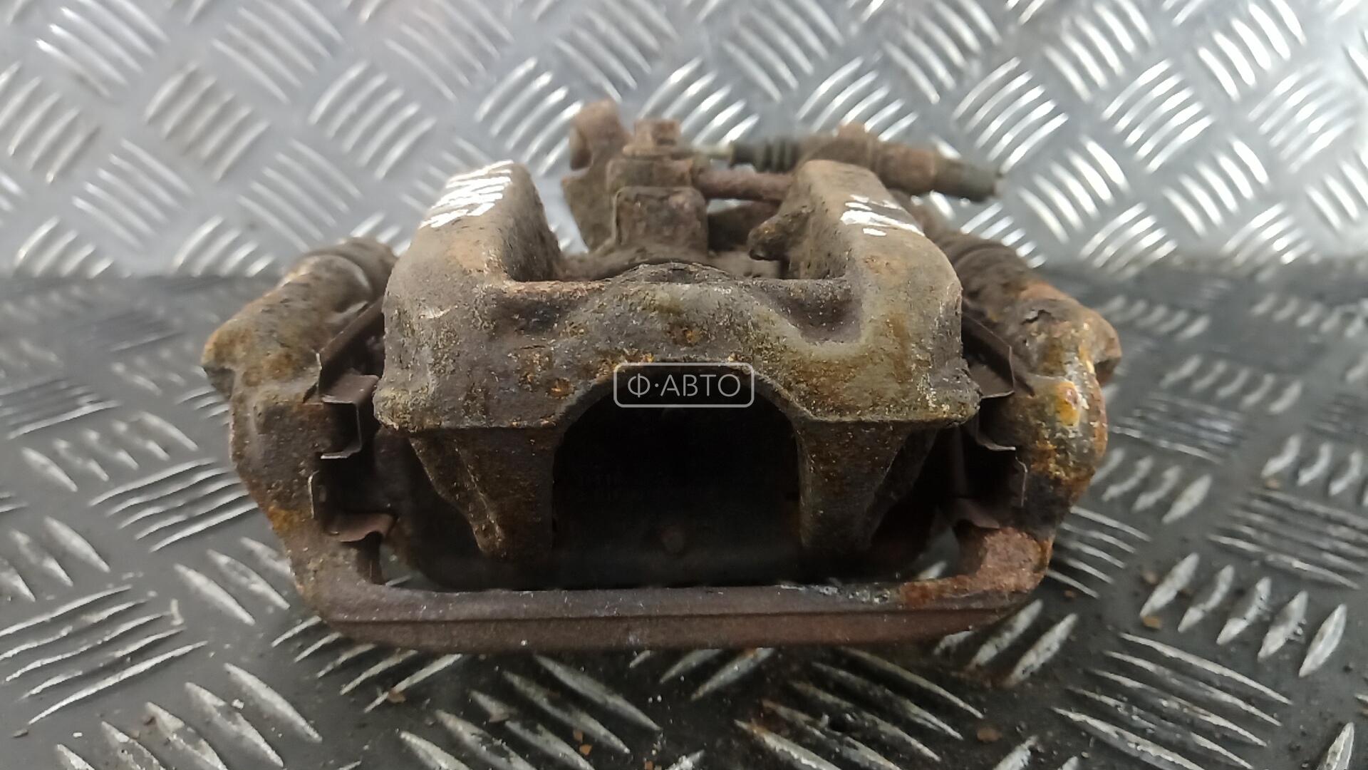 Суппорт тормозной задний левый