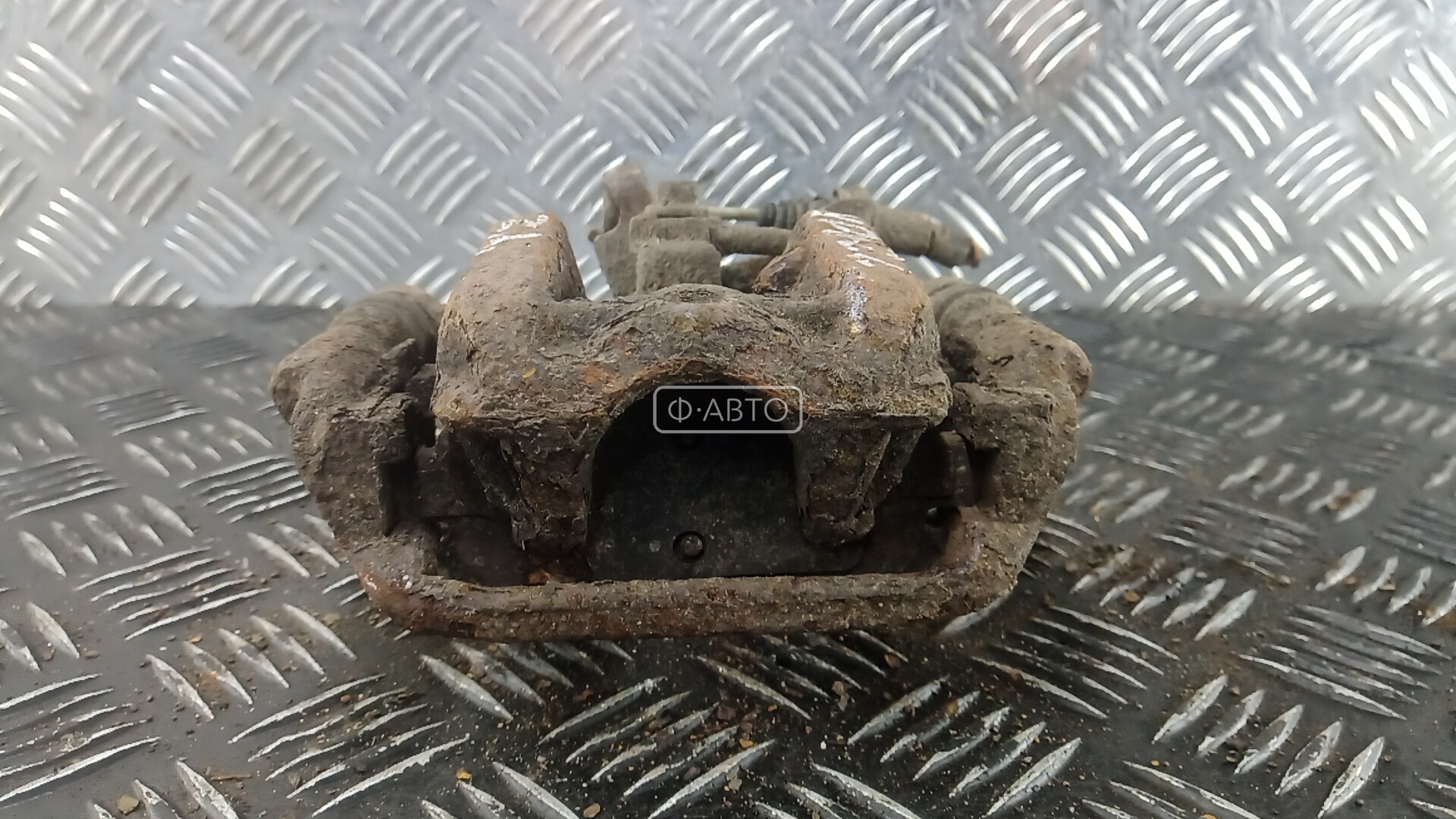 Суппорт тормозной задний левый