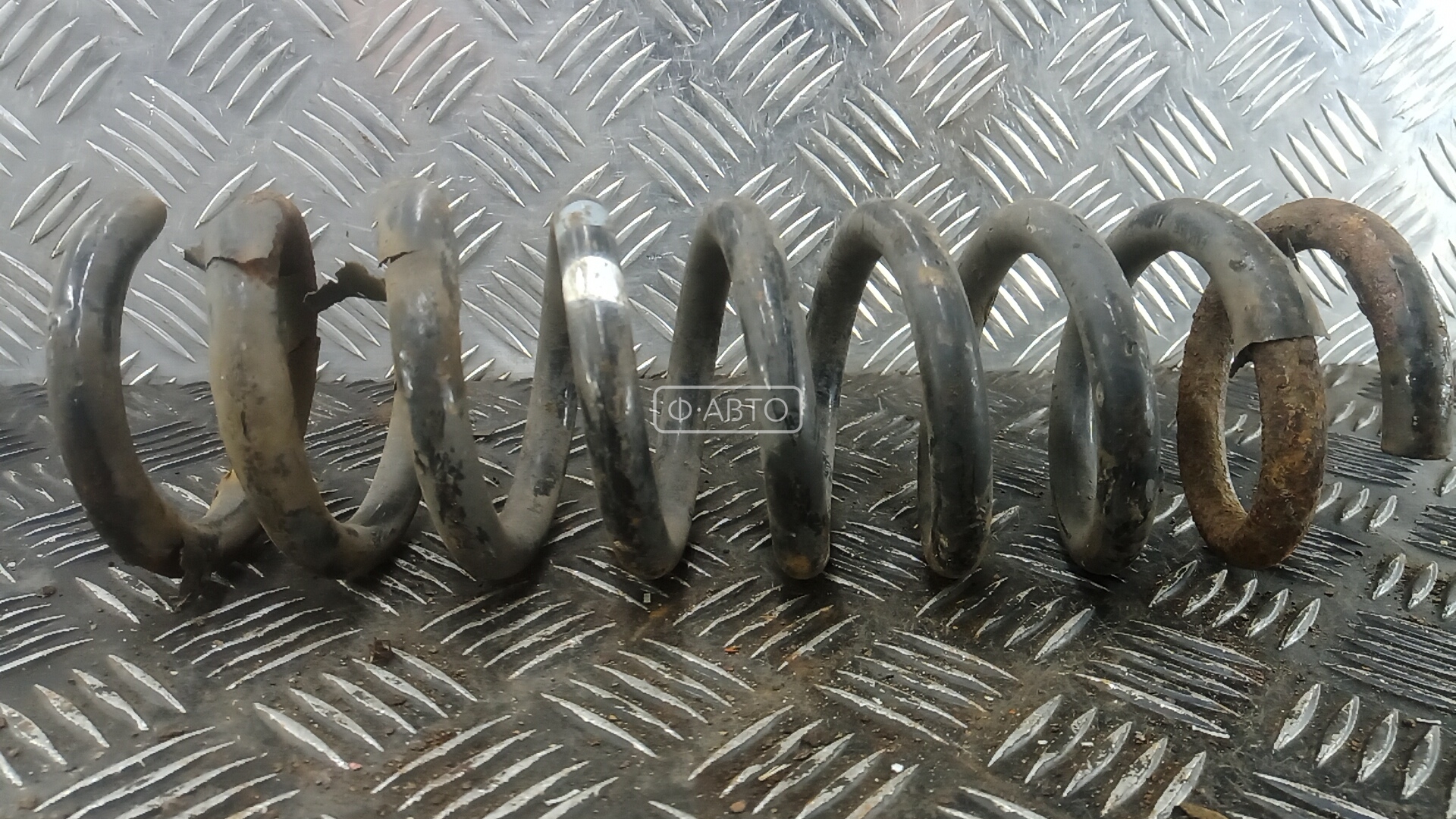 Пружина задняя