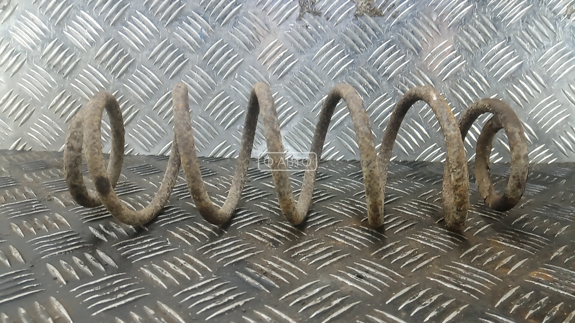 Пружина задняя