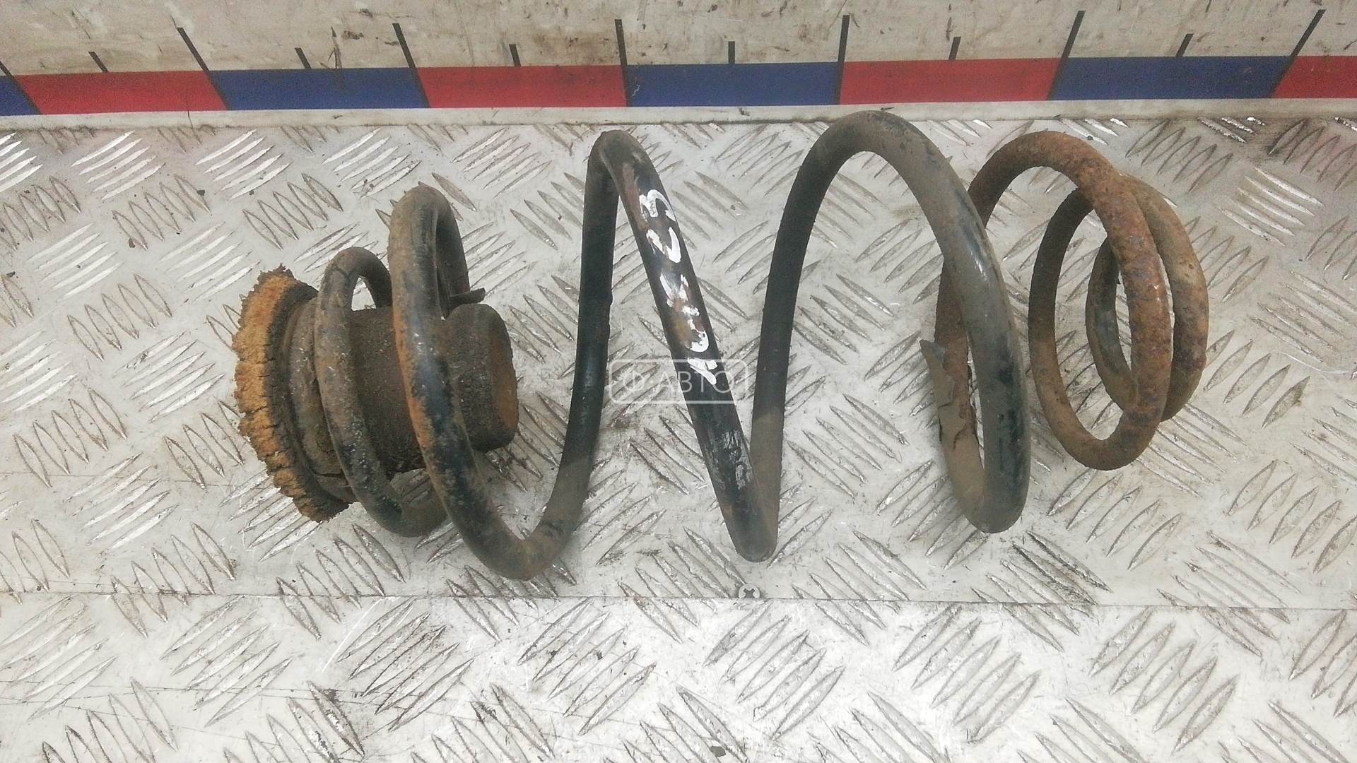 Пружина задняя