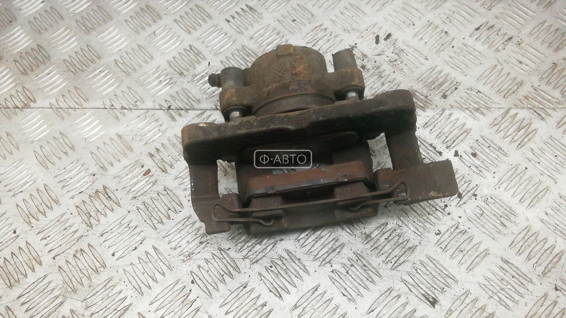 Суппорт тормозной передний левый