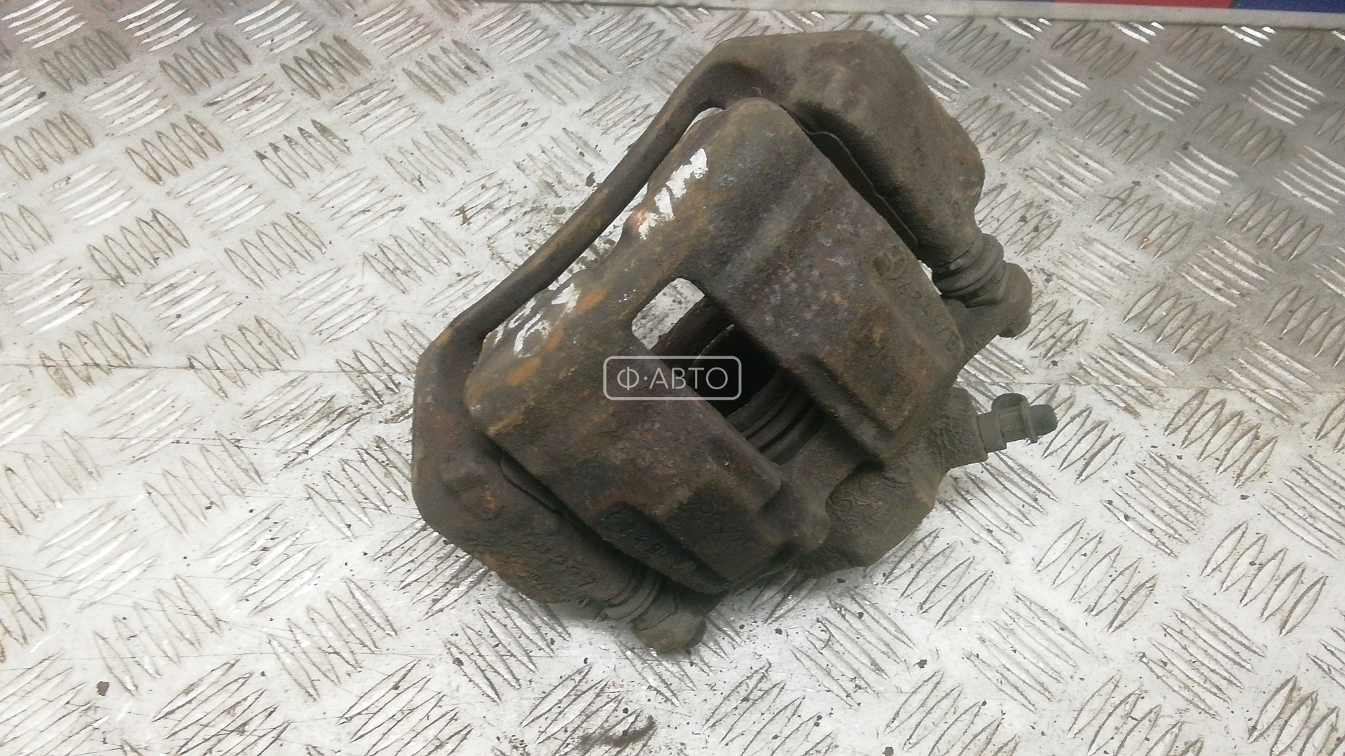 Суппорт тормозной передний левый