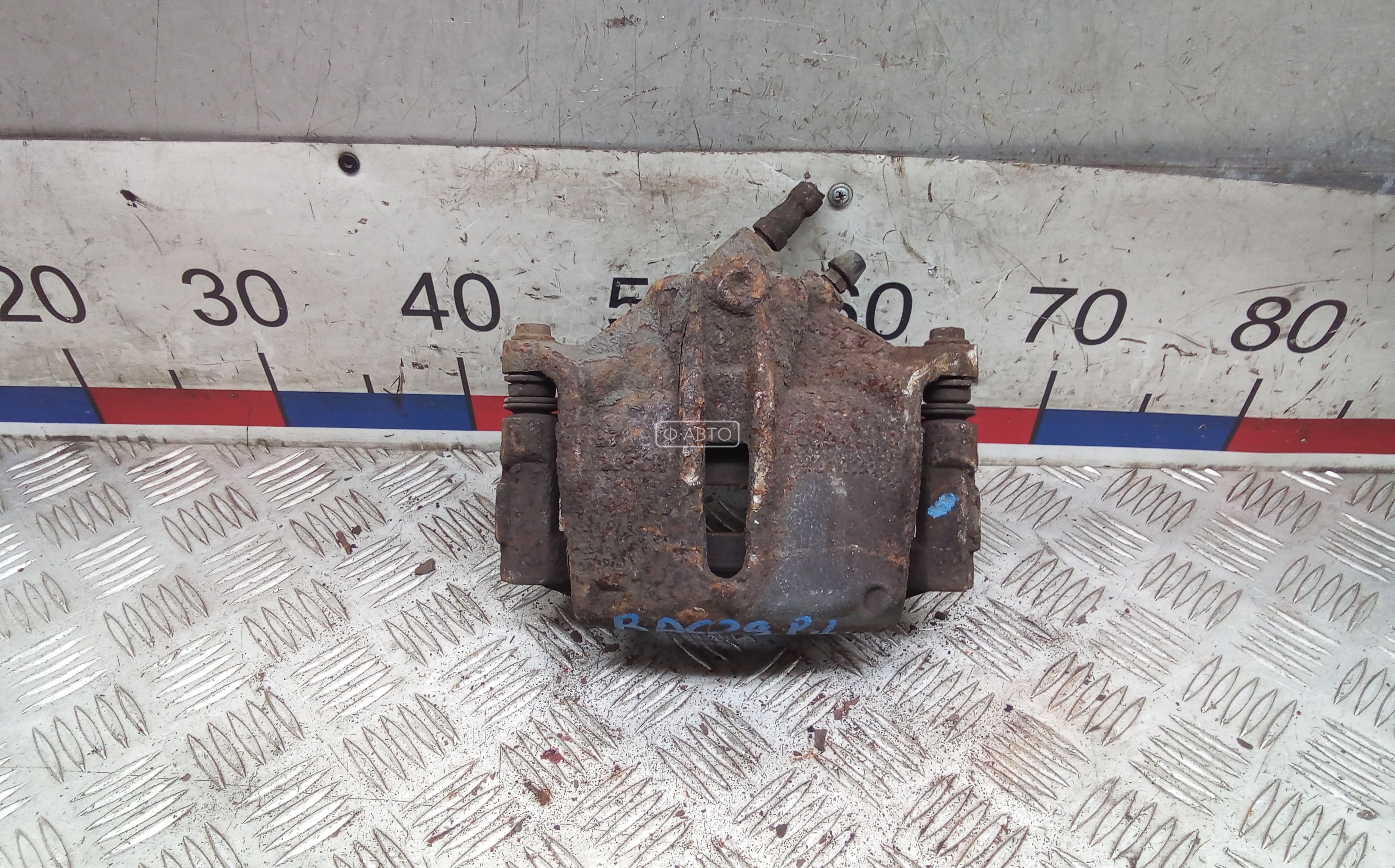 Суппорт тормозной передний левый