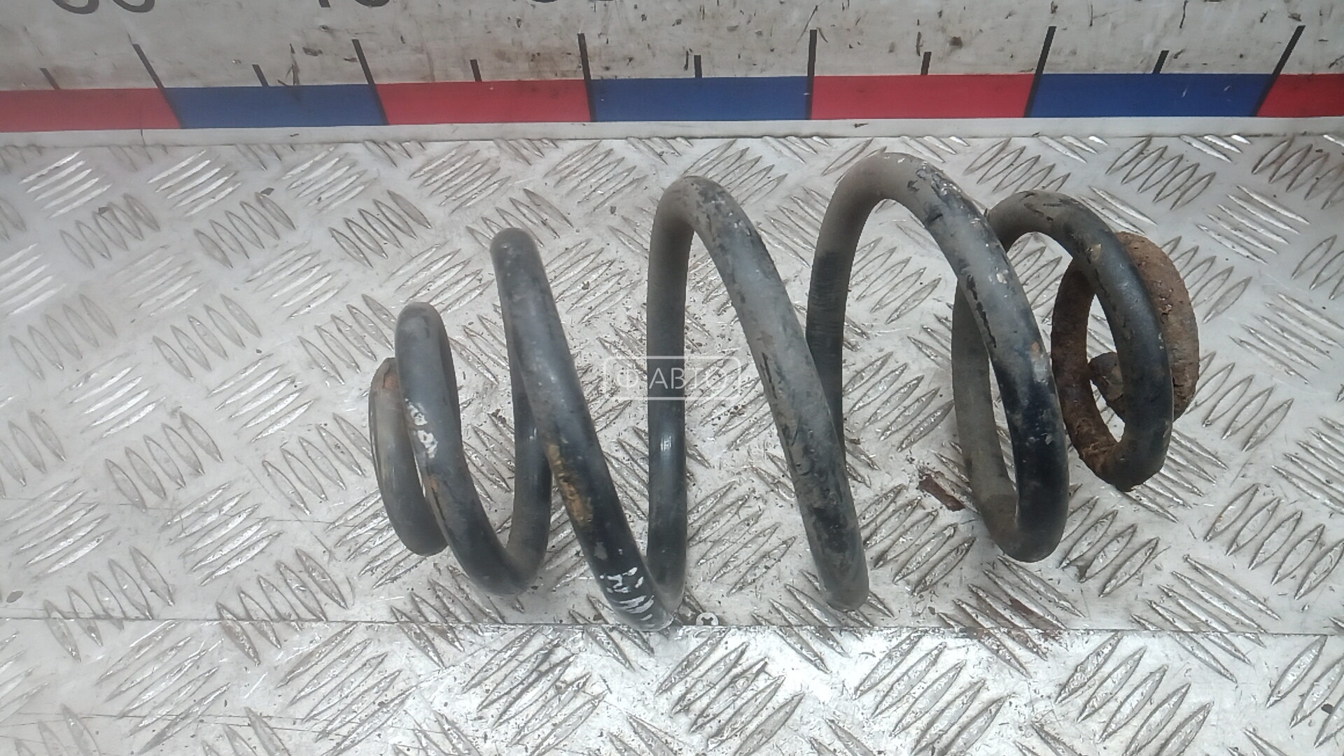 Пружина задняя