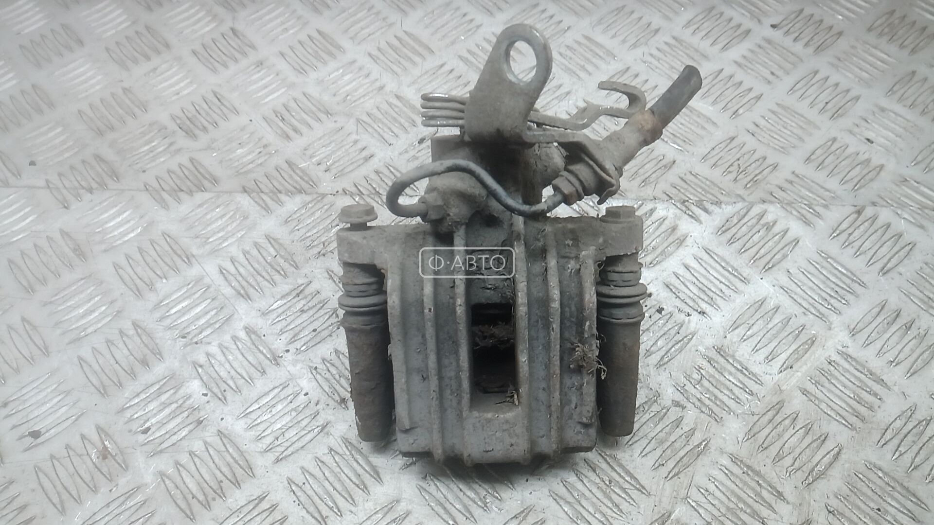 Суппорт тормозной задний левый