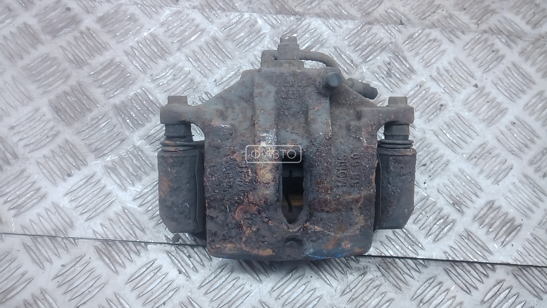 Суппорт тормозной передний левый