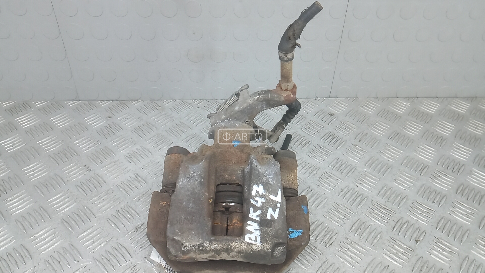 Суппорт тормозной задний левый