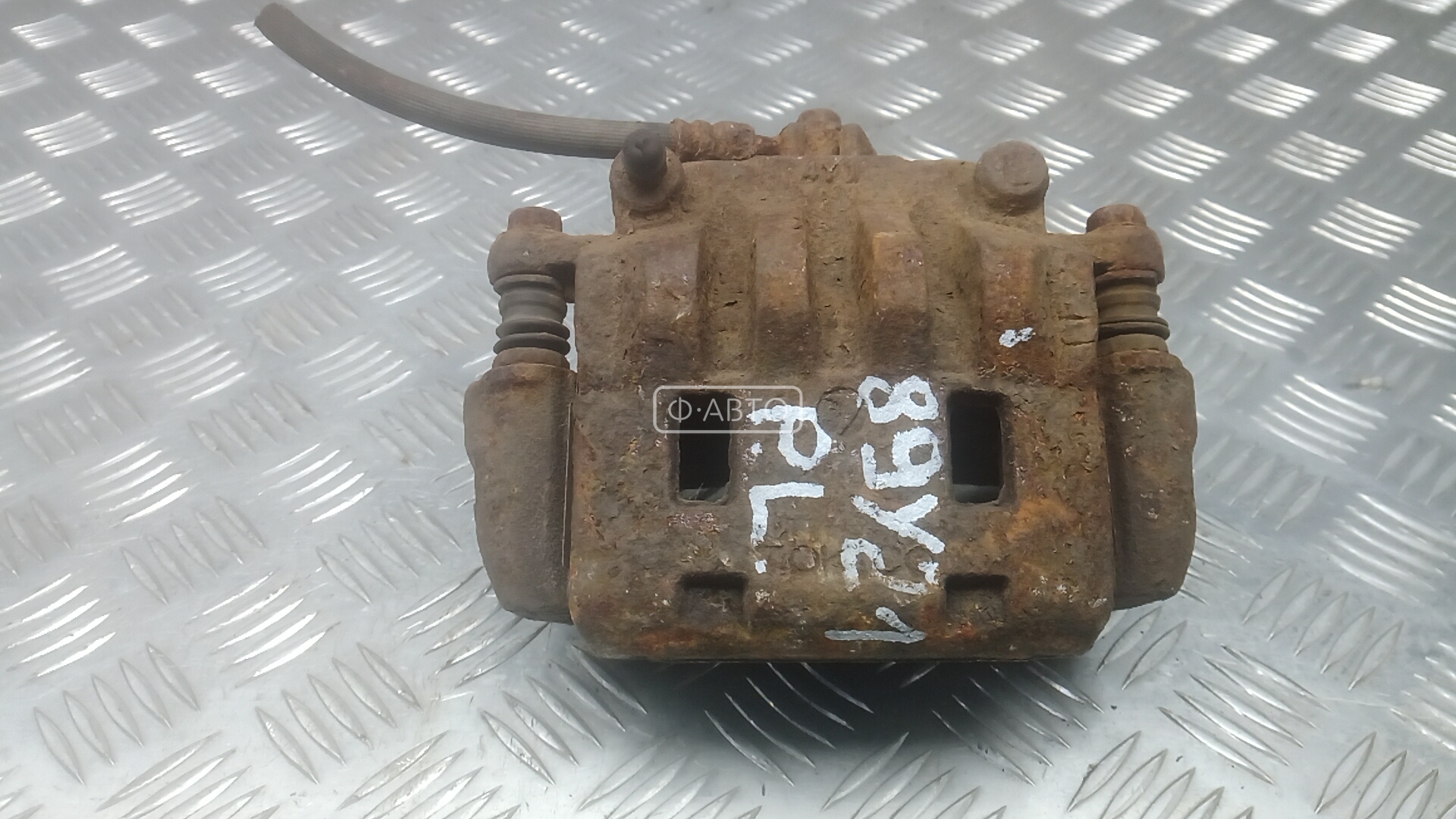 Суппорт тормозной передний левый