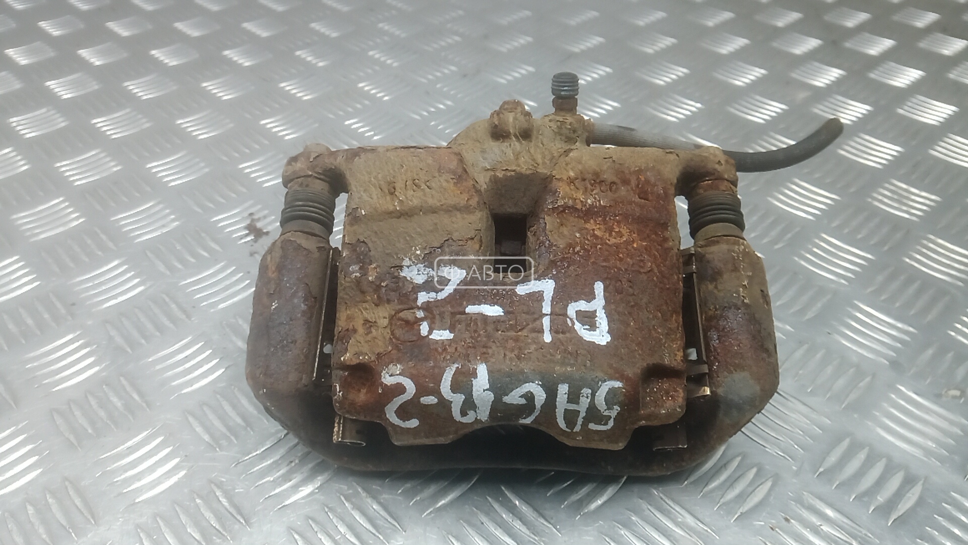 Суппорт тормозной передний левый