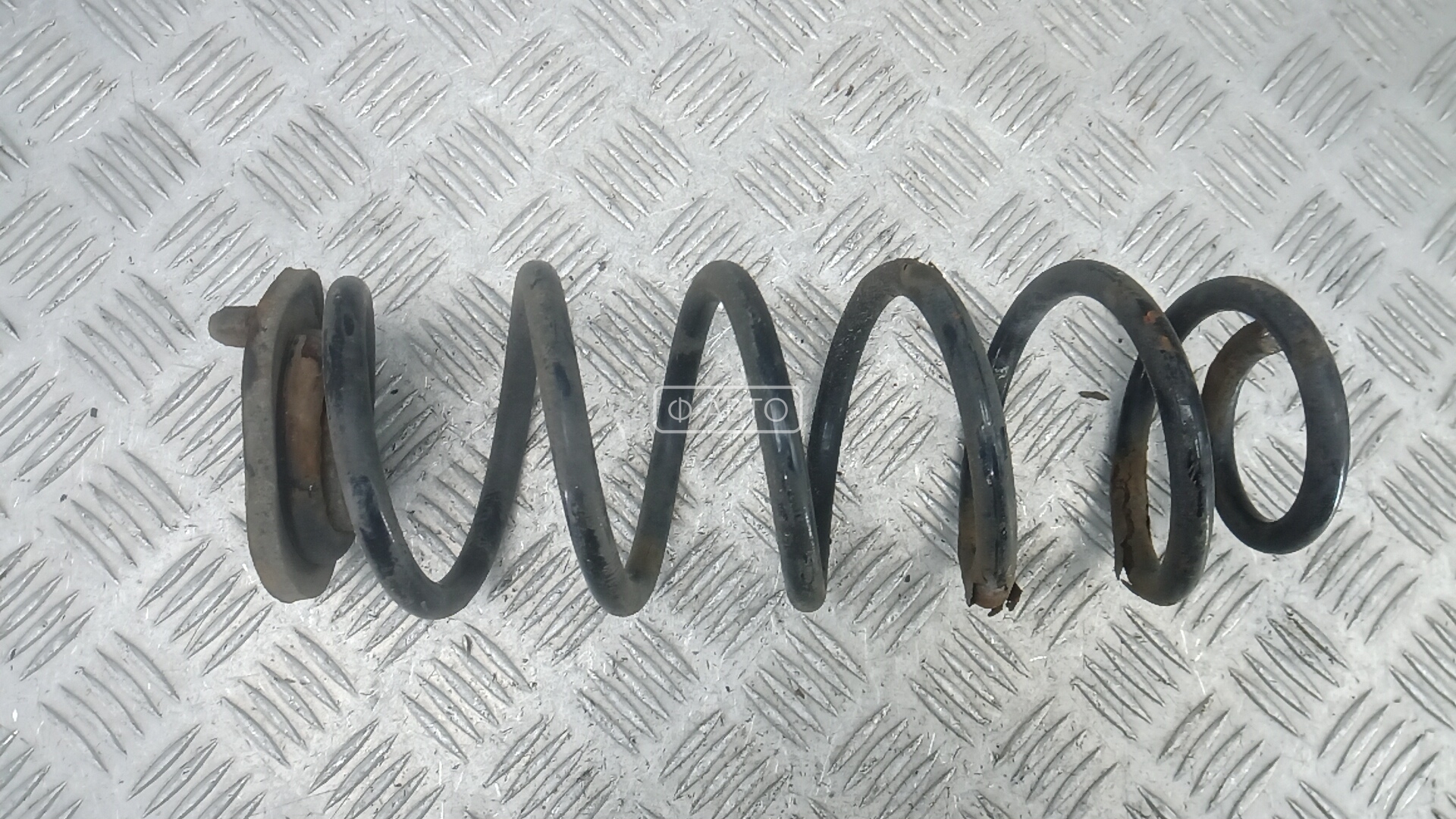 Пружина задняя